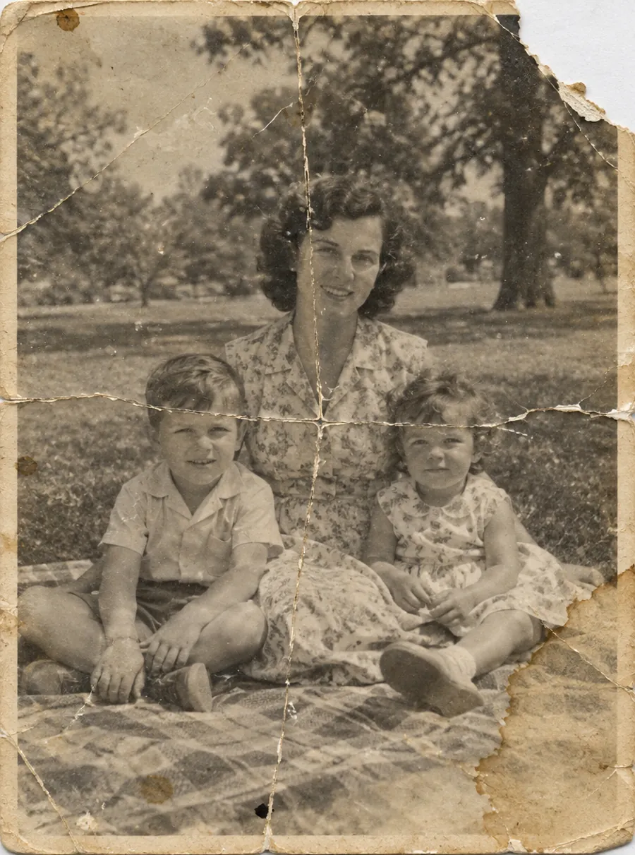 Before: a torn and creased 1950s family photo restored